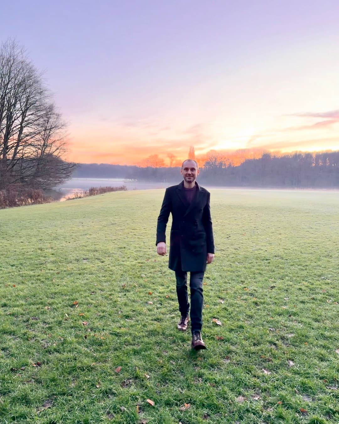 Miloš walking through a Dutch polder at sunset